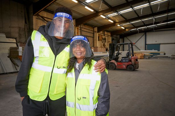 Marcus and his mum Melanie visiting a FareShare warehouse (Image: PA)